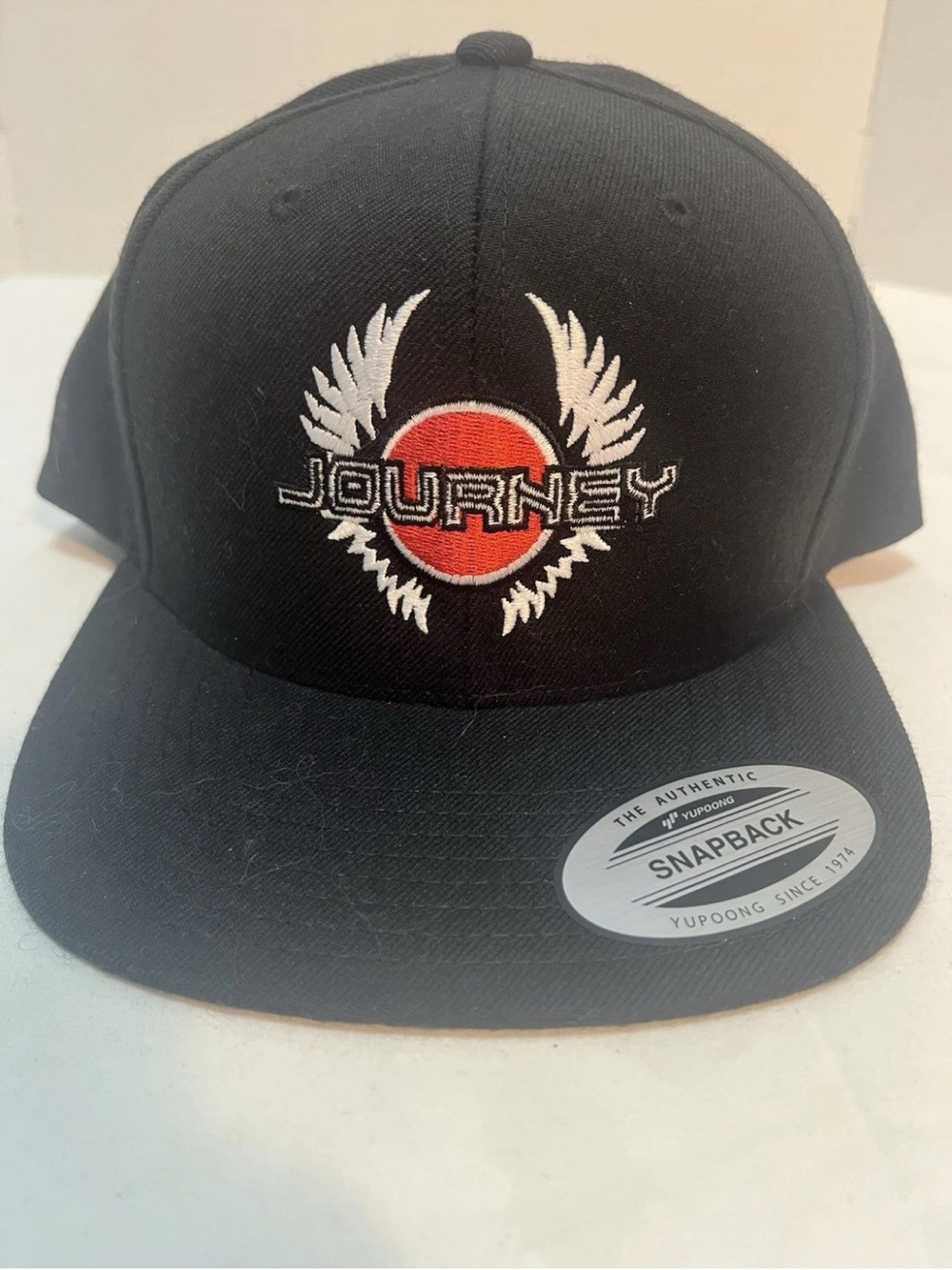 Journey Logo Black Snapback Hat with Red Accent